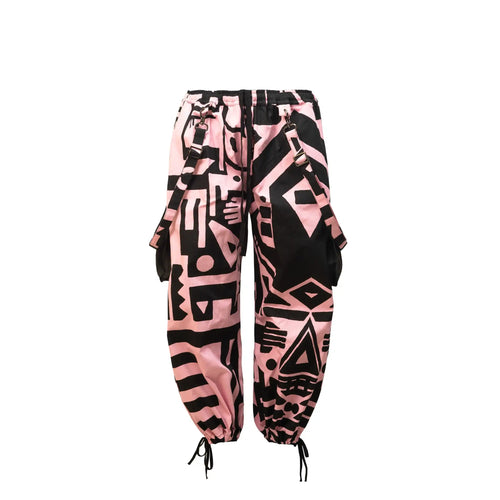 Flat lay of BAM-BAM Pink and Black Bagus Pants showing abstract cubist prints and sustainable streetwear design.