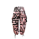 Product display of BAM-BAM Pink & Black Bagus Pants emphasizing modern streetwear silhouette.