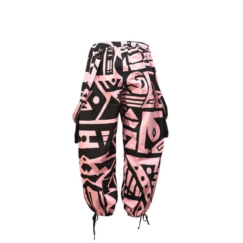 Product display of BAM-BAM Pink & Black Bagus Pants emphasizing modern streetwear silhouette.