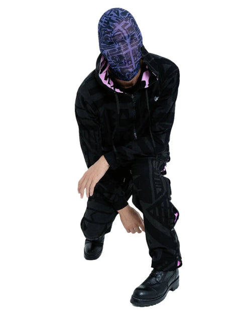 Model Wearing Purple and Black BAM-BAM headmask highlighting cubist patternism and sustainable design.
