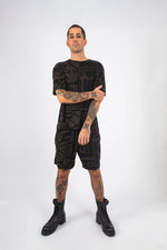 Detail shot of Charcoal and Black BAM-BAM Oversized Tee and abstract print finish.