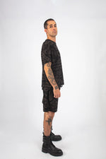 Model wearing Charcoal and Black BAM-BAM Oversized Tee with relaxed, self-expressive pose.