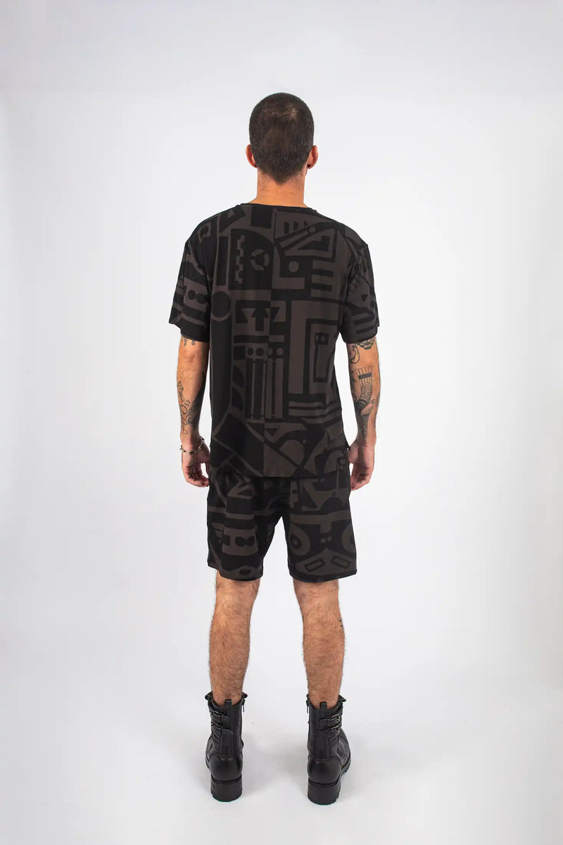 Back of Charcoal and Black BAM-BAM Oversized Tee captured in artistic streetwear styling.