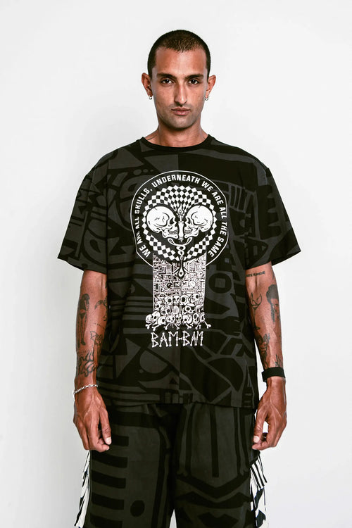 Model wearing BAM-BAM One Love Charcoal Oversized Tee, expressing unity through wearable art.