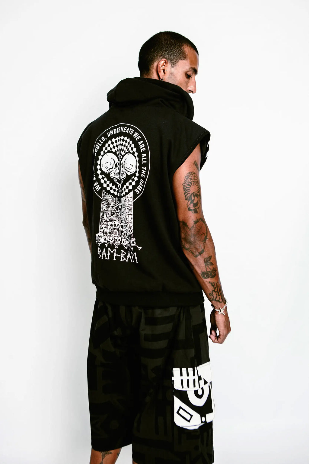 Model showing bamboo lining and bold “We Are All Skulls” message from the ONE LOVE collection.