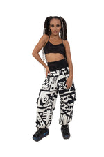 Female model wearing BAM‑BAM black and white bagus pants and matching bra top, showcasing cubist patternism