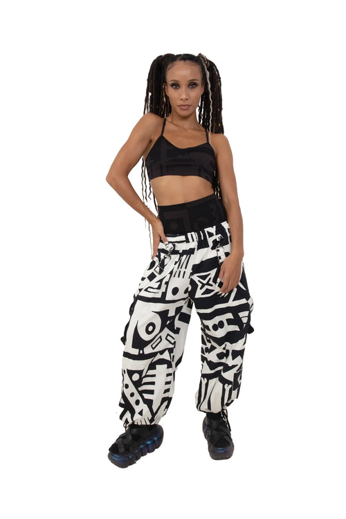 Female model wearing BAM‑BAM black and white bagus pants and matching bra top, showcasing cubist patternism