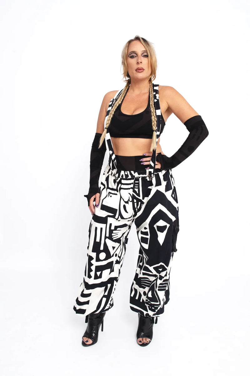 Model posing with hands on hips in black and white BAM‑BAM bagus pants demonstrating wearable art