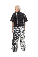Back view of BAM-BAM black and white graphic overalls with adjustable straps and cargo pockets.