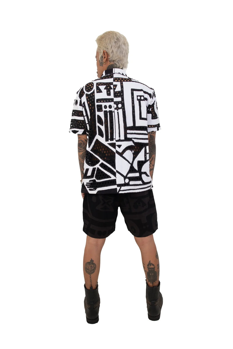 Close‑up of BAM‑BAM round mesh shirt fabric and circular cut‑out pattern reflecting artistic streetwear