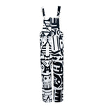 Flat lay of black and white BAM‑BAM dungarees with abstract prints, wearable art and sustainable streetwear