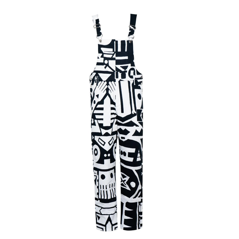 Flat lay of black and white BAM‑BAM dungarees with abstract prints, wearable art and sustainable streetwear