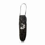 Side view of BAM‑BAM charcoal baggy pants highlighting loose fit and abstract prints