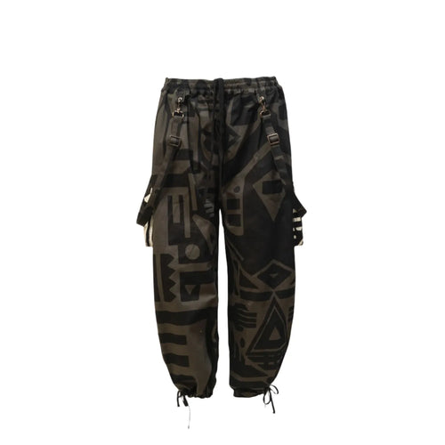 Flat lay of charcoal BAM‑BAM baggy pants with abstract prints and sustainable streetwear style