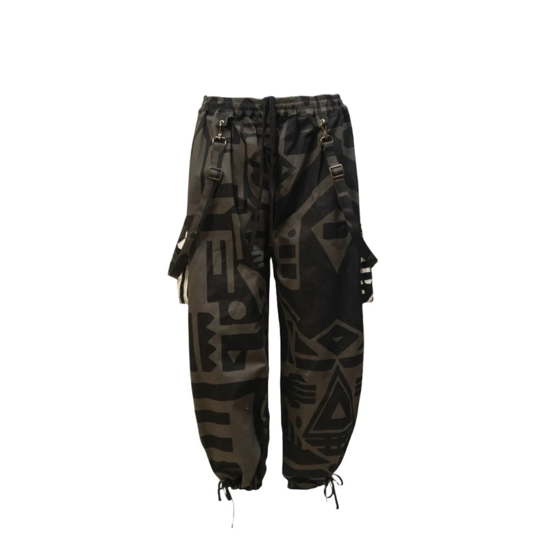 Flat lay of charcoal BAM‑BAM baggy pants with abstract prints and sustainable streetwear style