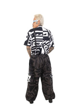 Back view of BAM‑BAM charcoal baggy pants with relaxed fit and sustainable streetwear design