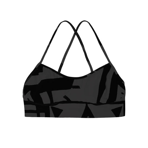 Flat lay of charcoal black BAM‑BAM bra top with abstract prints and sustainable streetwear style