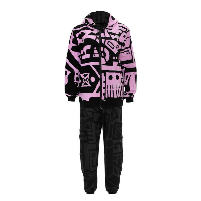 Model walking in charcoal and pink BAM‑BAM poppa pants showing artistic streetwear and cubist patternism