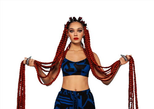 Model wearing dark blue BAM‑BAM bra top with red braids, showcasing cubist patternism and wearable art