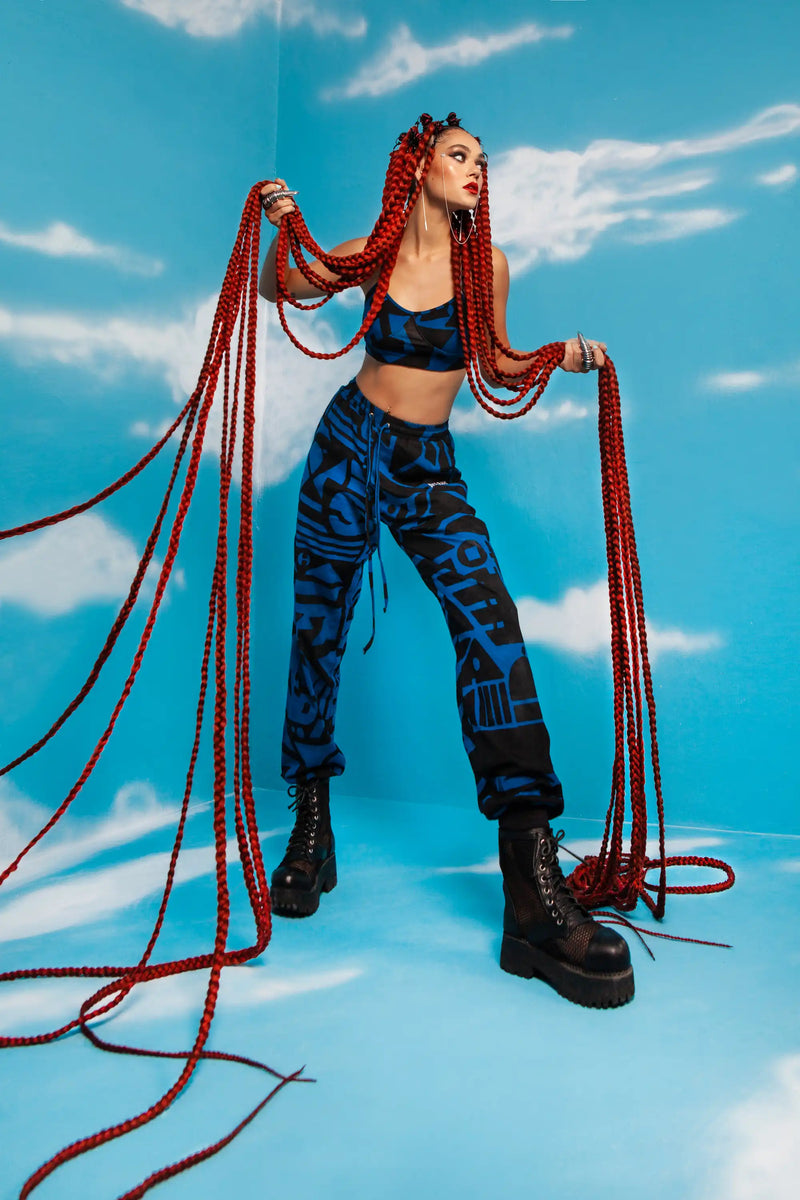 Bold cubist print bra top in deep blue and black tones, urban streetwear piece designed for self-expression.
