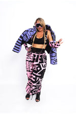 Styled of Pink and Black Bagus Pants in motion, reflecting bold self-expression in wearable art.