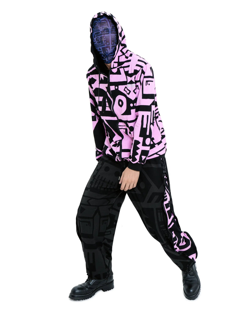 Model waering reversible charcoal and pink BAM‑BAM hoodie showing hood and sustainable streetwear design