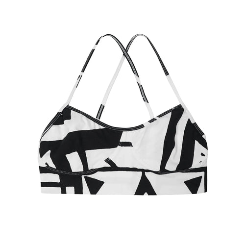 Black and white bra top flat lay with abstract prints by BAM‑BAM, wearable art and sustainable streetwear