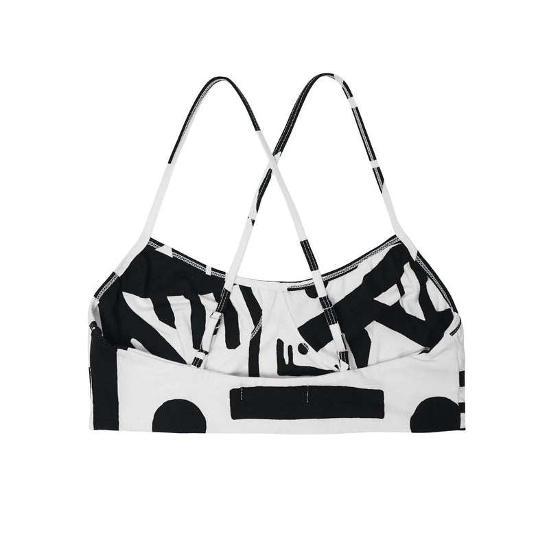 Back view of black and white BAM‑BAM bra top highlighting straps and sustainable streetwear design