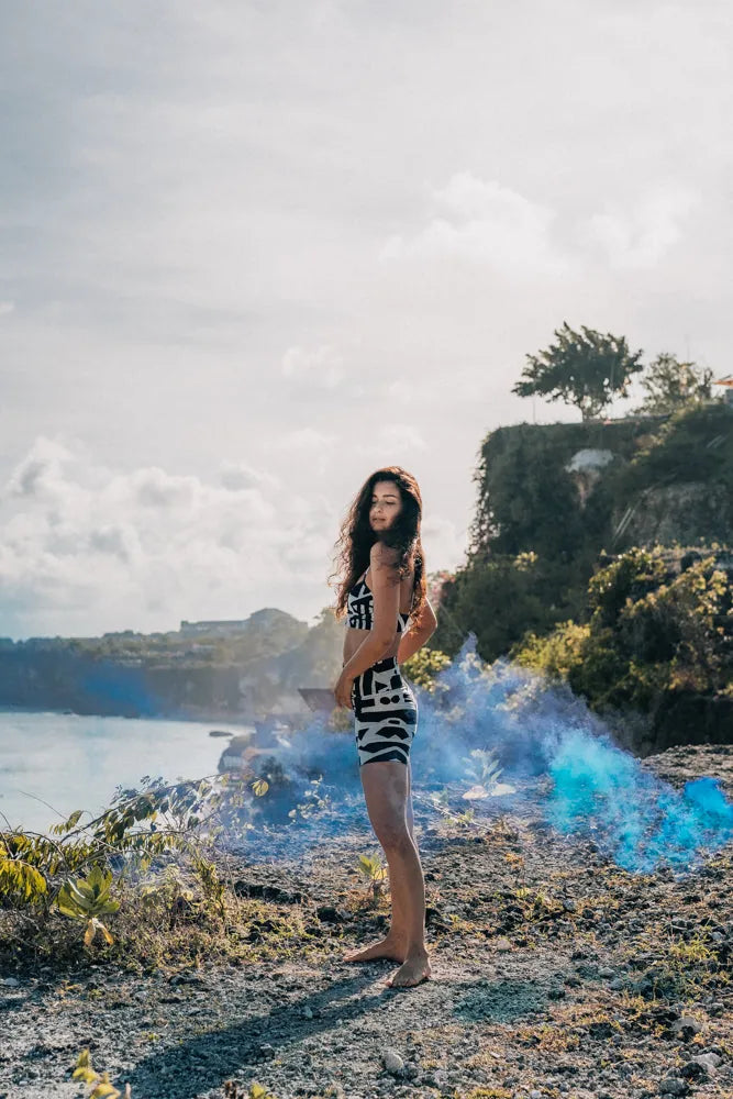 Side view of BAM‑BAM bra top on model showing abstract prints and artistic streetwear aesthetic
